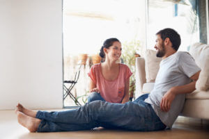 Shot of a romantic young couple spending quality time together in their living room