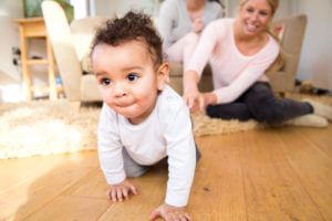 Baby boy crawling at home